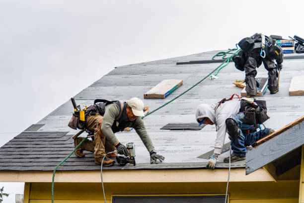 Professional Roofing technician working in Milroy, IN